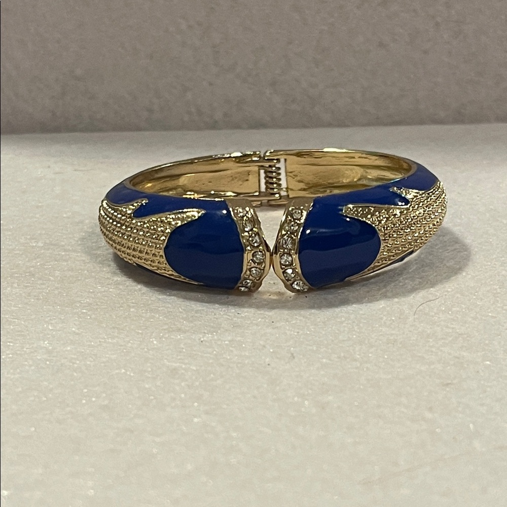 AMRITA SINGH Gold Tone, Crystals, Blue Enamel Graduated Hinged Clamper Bracelet.